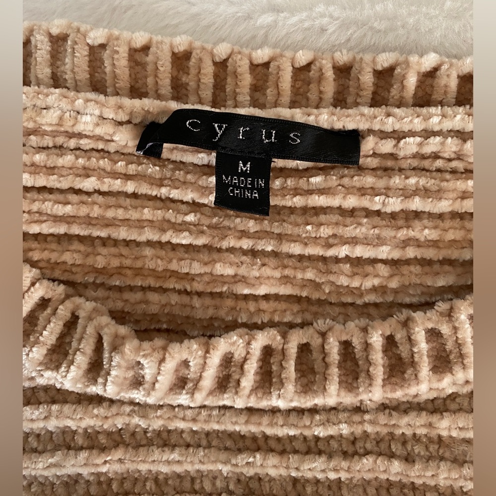 Tan/gold-ish sweater.